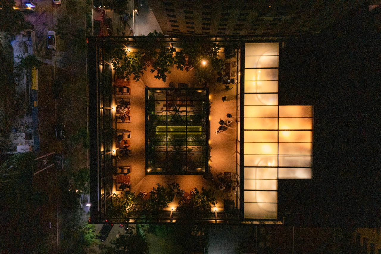 Crem outlet terrace lit at night in Dhaka
